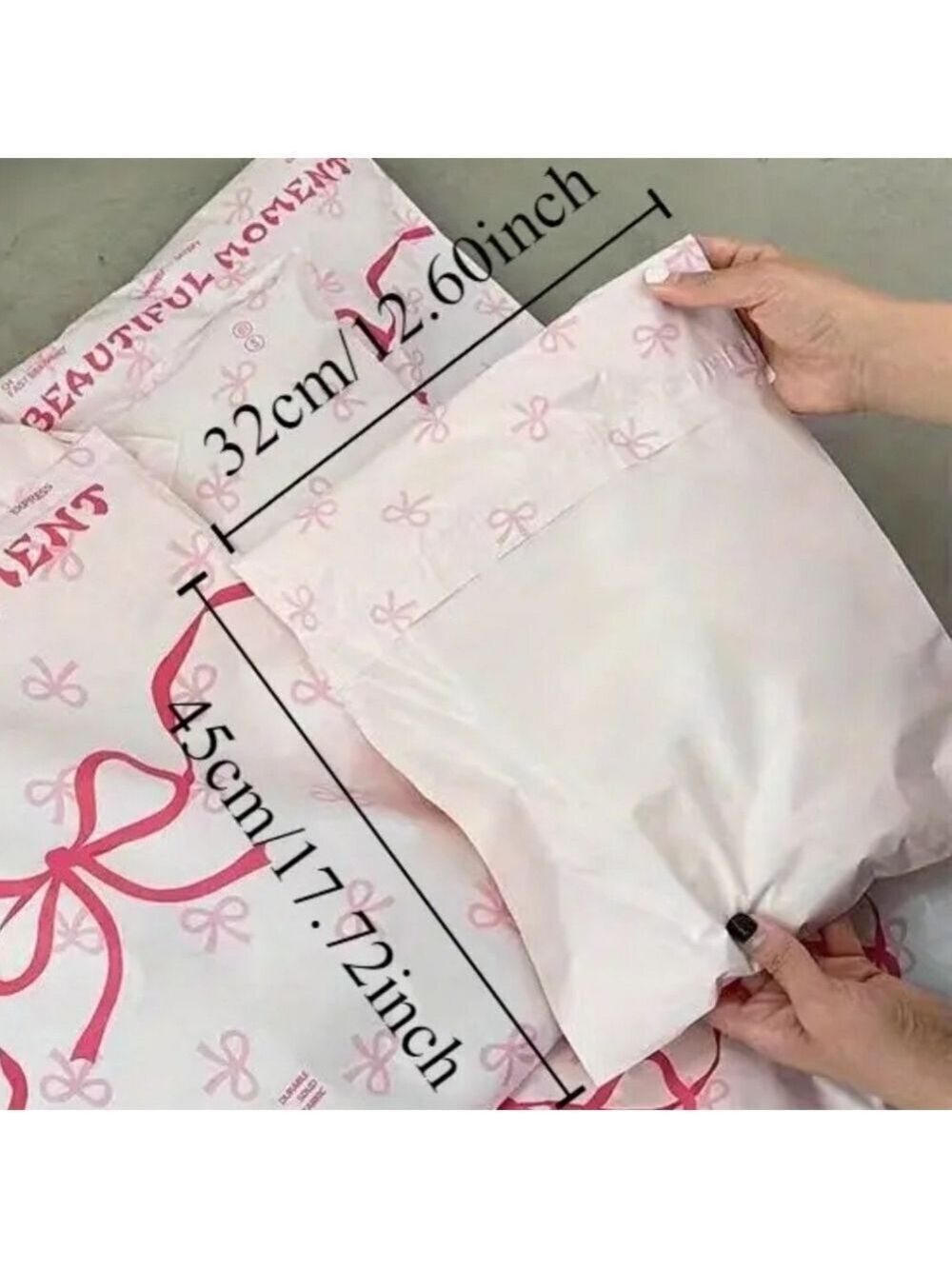Ten 12.60 x 17.72 inches poly mailers in baby pink with bright pink bows